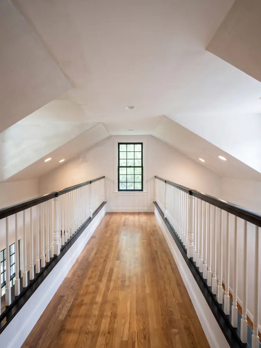 New plaster walls and ceiling in a stairwell after demolition in Concord