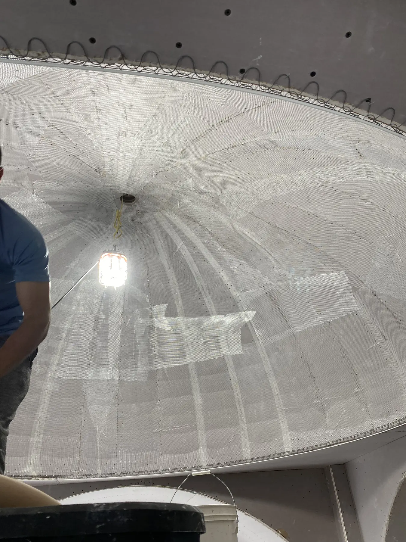 Owner restoring the large vaulted plaster ceiling