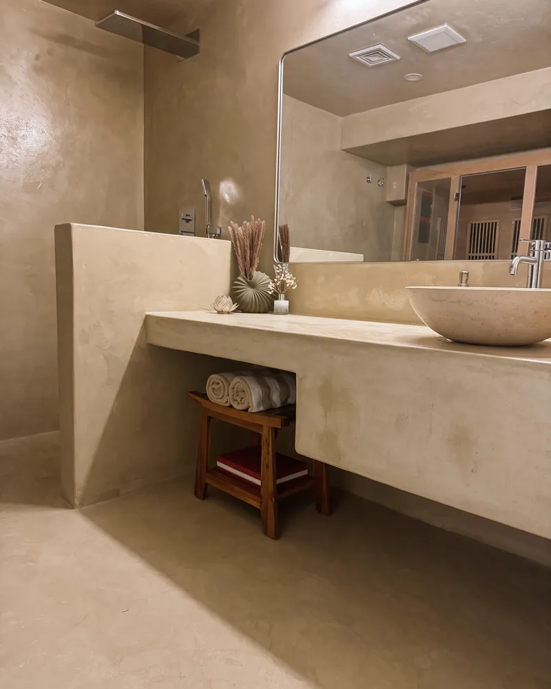 Microcement shower half wall and floating vanity in Newburyport
