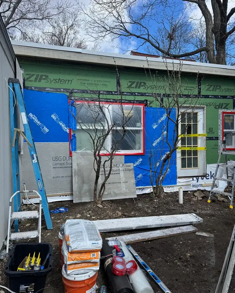 Exterior wall with sheathing and weather-resistant wrap before stucco