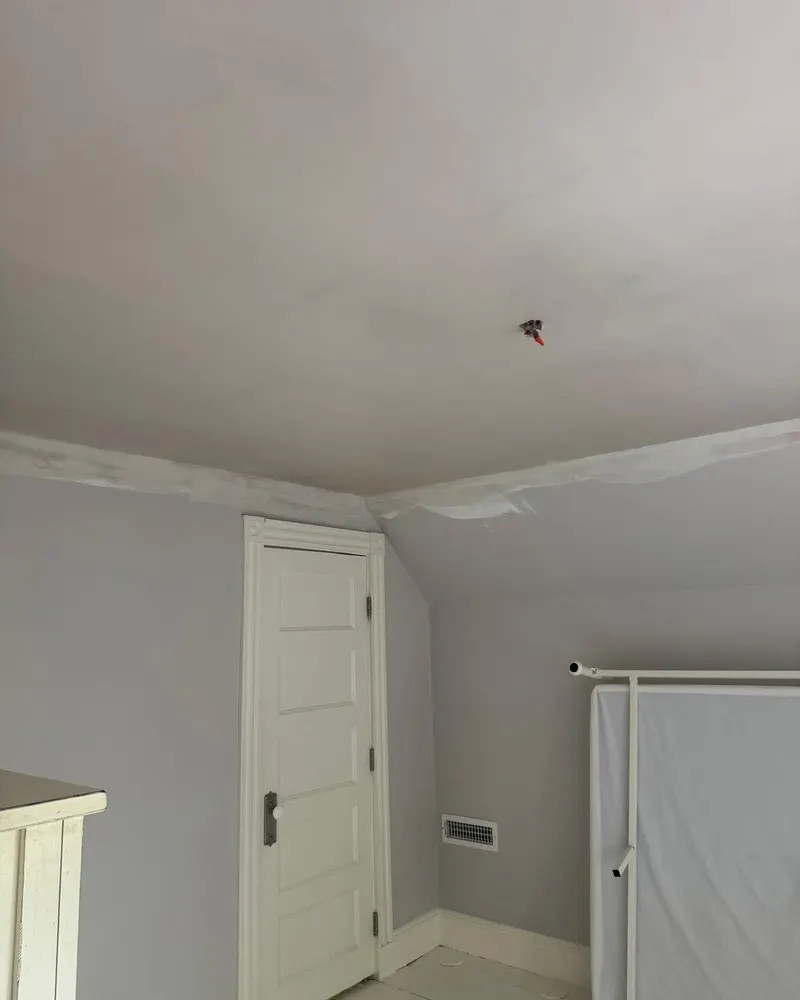 Repaired ceiling and slope finished after water damage